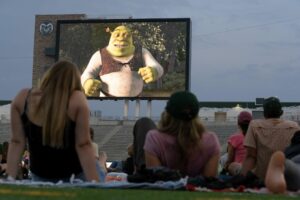 A crowd watches Shrek at Canvas Stadium.